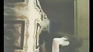 Nella cameretta del figlio mentre il marito non c'è